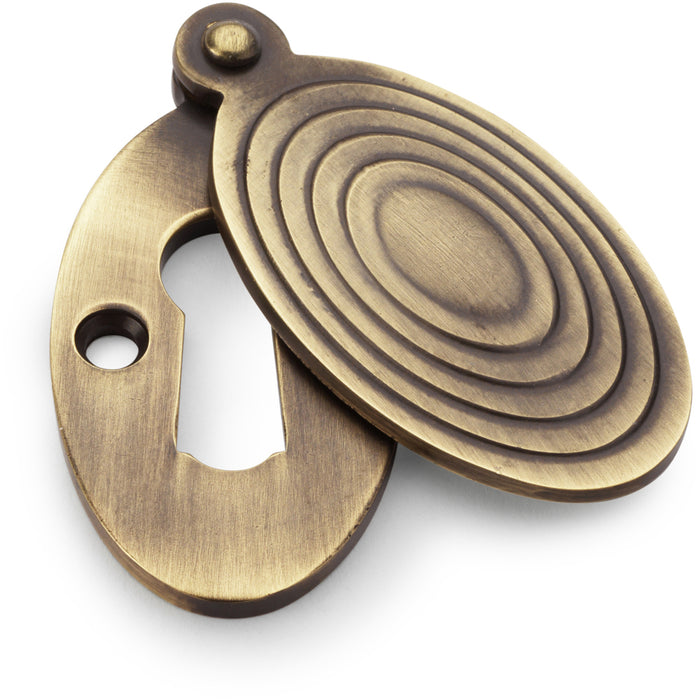 Oval Standard Lock Profile Escutcheon & Ringed Swing Cover - Antique Brass