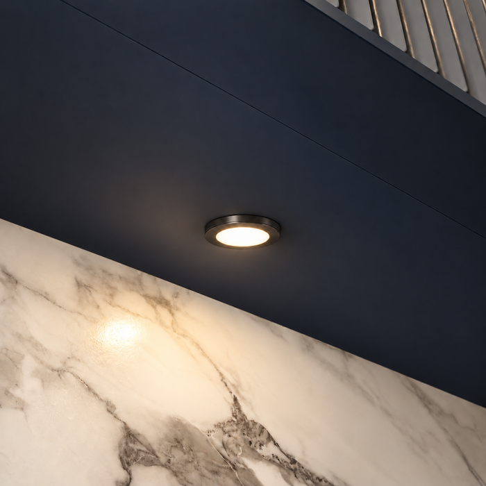 Black Super Slim Round Surface Mounted LED Under Cabinet Light installed beneath kitchen cabinets
