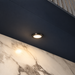 Black Super Slim Round Surface Mounted LED Under Cabinet Light installed beneath kitchen cabinets