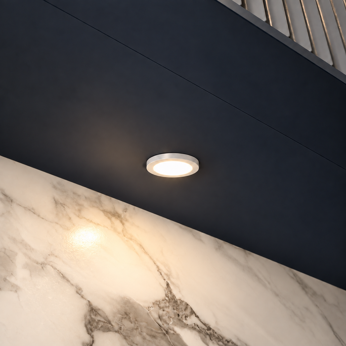 White Super Slim Round Surface Mounted LED Under Cabinet Light installed beneath kitchen cabinets