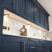 Aluminium Triangle Surface Mounted LED Under Cabinet Light installed beneath kitchen cabinets