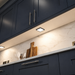 Black Low Profile Square Surface Mounted LED Under Cabinet Light installed beneath kitchen cabinets