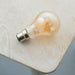 LED Filament Lamp Bulb Dimmable 6W B22 GLS LED Amber Tinted Glass Warm White